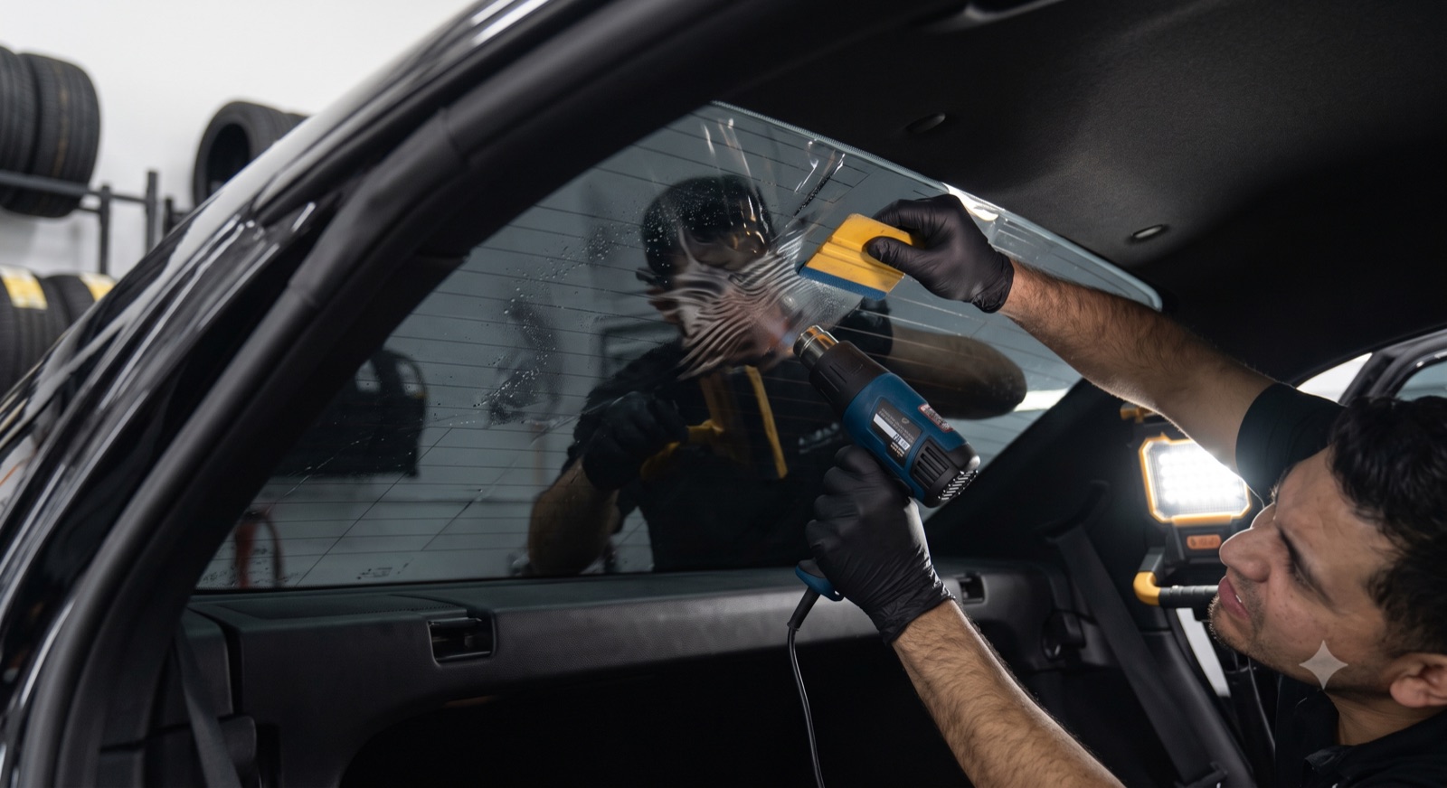 Window tint being applied